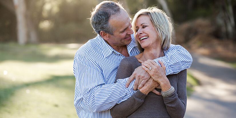 man and woman hugging